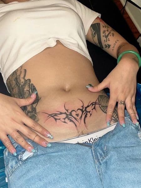 Tribal + Black-work tribal shapes tattoo on Stomach by emilymadison on TattMe