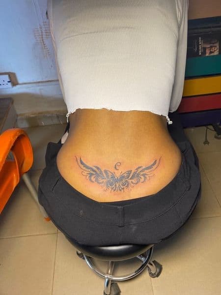 Black & Grey + Illustrative butterfly tattoo on Lower Back by emilymadison on TattMe