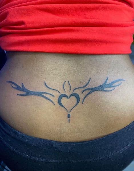 Tribal + Black-work heart tattoo on Lower Back by emily_madison on TattMe
