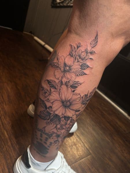 Floral + Black & Grey flowers tattoo on Calf by trktattoos on TattMe