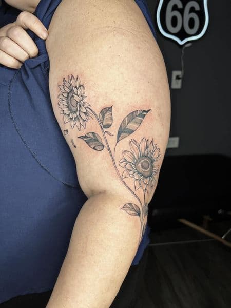 Floral + Black & Grey sunflowers tattoo on Upper Arm by Taylor_Miller on TattMe