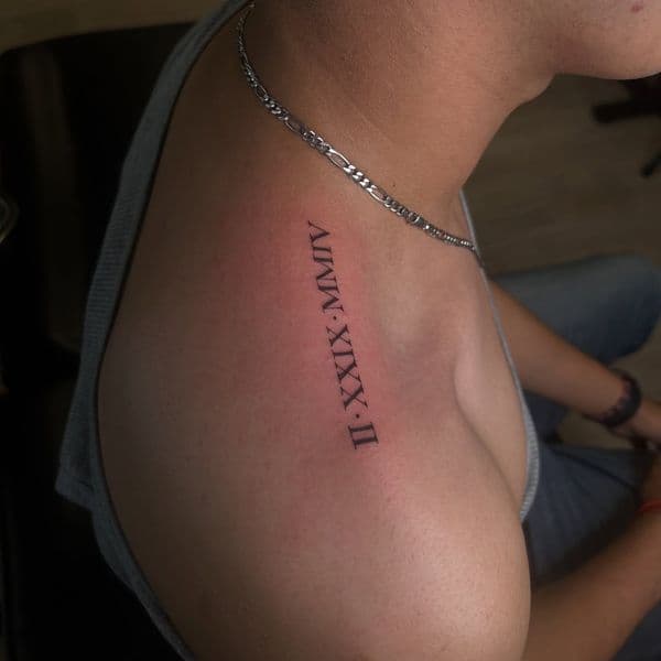 Lettering + Script roman numerals tattoo on Shoulder by Ink_By_Loren on TattMe