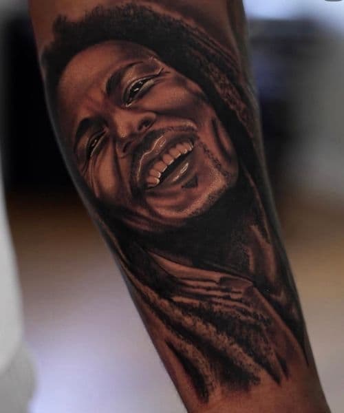 Photo Realism + Black & Grey bob marley tattoo on Forearm by oldtown_ink on TattMe
