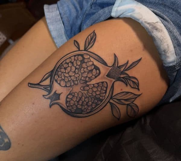 Black & Grey + Illustrative pomegranate tattoo on Thigh by katetattoo on TattMe