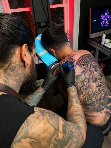 Realism + Black & Grey greek god tattoo on Upper Back by johnnytatt on TattMe