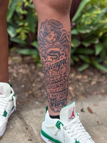 Black & Grey + Lettering cherub tattoo on Calf by kriko on TattMe