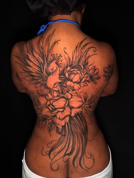 Black & Grey + Illustrative phoenix tattoo on Upper Back by Ashley_Panda on TattMe