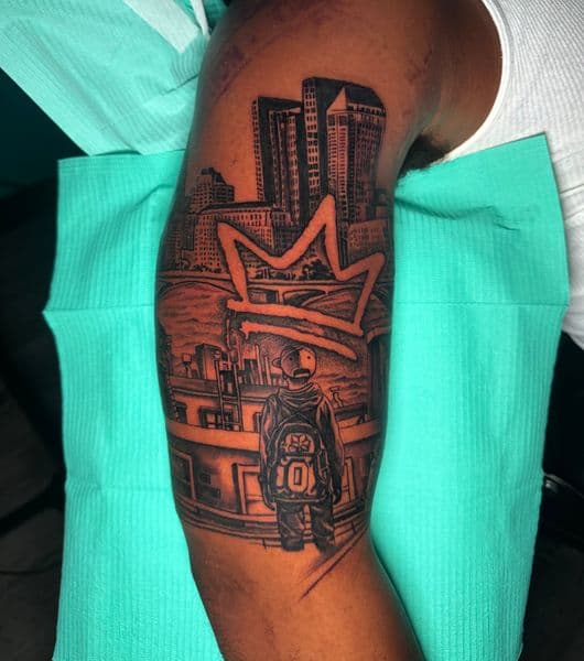 Black & Grey + Illustrative cityscape tattoo on Upper Arm by Ashley_Panda on TattMe
