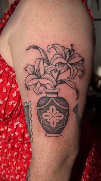 Black-work + Dot-work lilies tattoo on Upper Arm by TattMe on TattMe