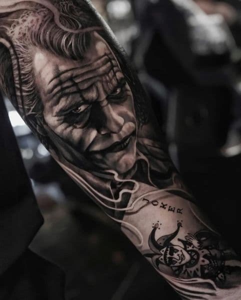 Realism + Black & Grey joker tattoo on Forearm by Daniella on TattMe