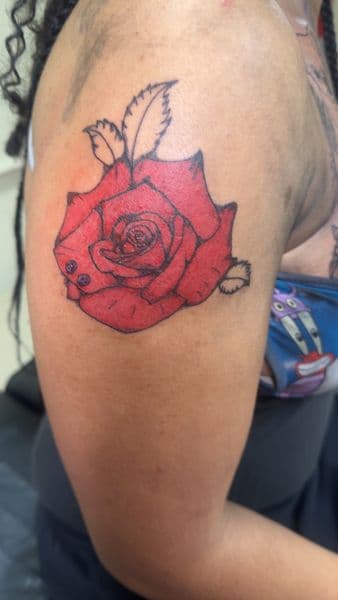 Color + Floral rose tattoo on Upper Arm by kingandqueentatz on TattMe