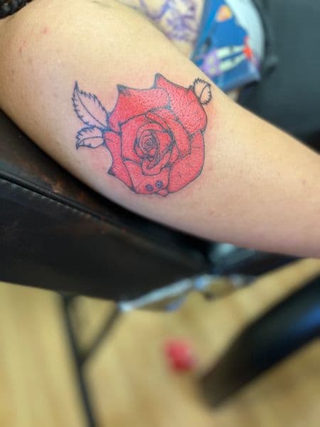Color + Illustrative rose tattoo on Upper Arm by kingandqueentatz on TattMe