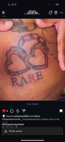 Line-work + Lettering handcuffs tattoo on Upper Back by kingandqueentatz on TattMe