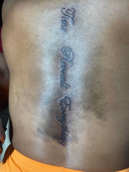 Lettering + Script text tattoo on Spine by kingandqueentatz on TattMe