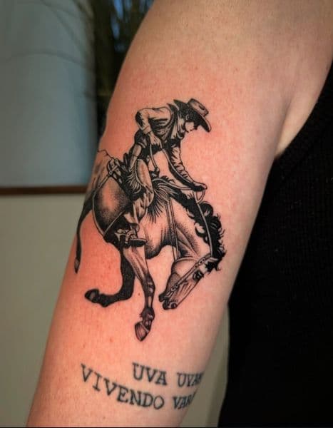 Black & Grey + Illustrative cowboy tattoo on Upper Arm by coreink on TattMe