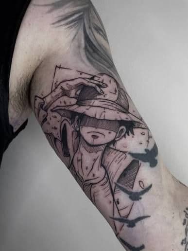 Black & Grey + Illustrative luffy tattoo on Upper Arm by spilledinkz on TattMe