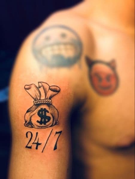 Black & Grey + Lettering money bag tattoo on Upper Arm by devil_tats_999 on TattMe