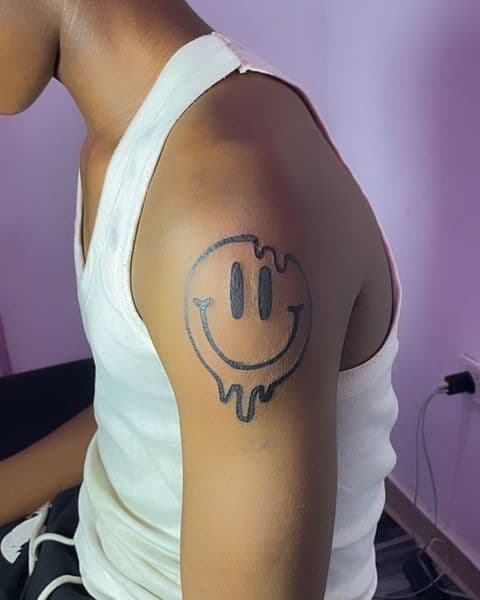 Cartoon + Illustrative smiley face tattoo on Upper Arm by devil_tats_999 on TattMe
