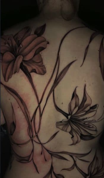 Floral + Black & Grey flowers tattoo on Upper Back by trendellatattoos on TattMe