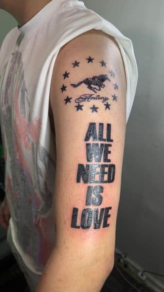 Lettering + Black-work text tattoo on Upper Arm by Logii_Tattoo on TattMe