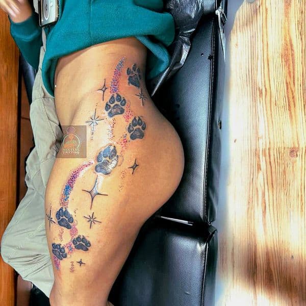Black & Grey + Color paw prints tattoo on Thigh by n3xtlvltatt on TattMe