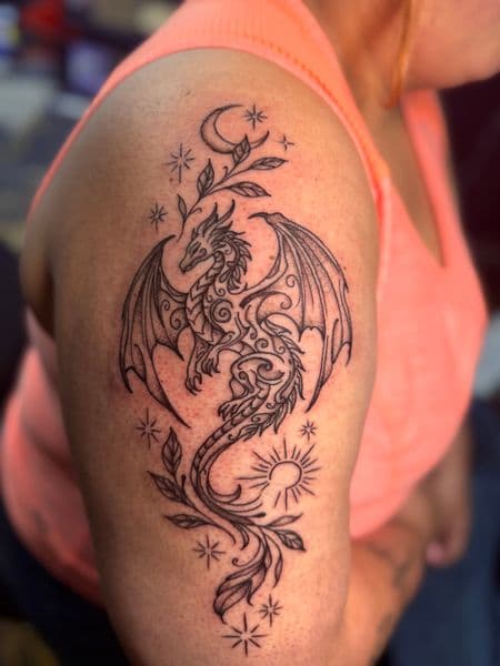 Line-work + Black-work dragon tattoo on Upper Arm by inkedbyaneye on TattMe