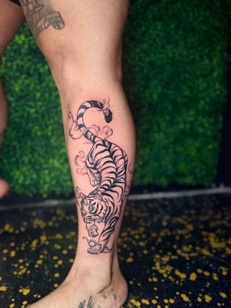 Black & Grey + Illustrative tiger tattoo on Calf by inkedbyaneye on TattMe