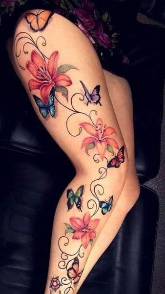 Floral + Color butterflies tattoo on Thigh by oliva on TattMe