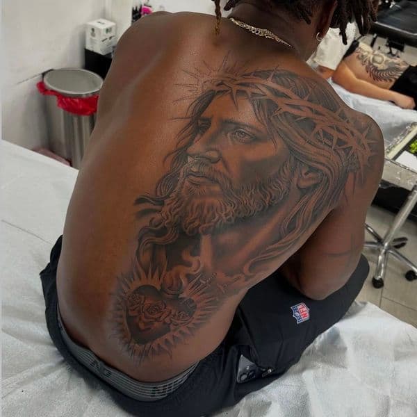 Realism + Black & Grey jesus tattoo on Upper Back by Marcus_Ink on TattMe