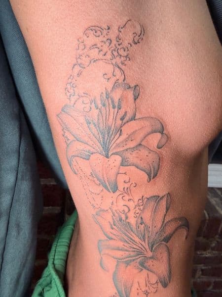Black & Grey + Fine Line lily tattoo on Ribs by Ana_Cloud on TattMe