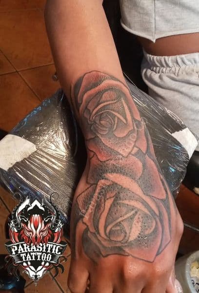 Black & Grey + Floral roses tattoo on Hand by Parasitic_Tattoo_Co. on TattMe