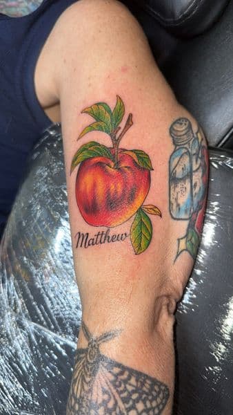 Illustrative + Color apple tattoo on Forearm by the_goat_images_ on TattMe