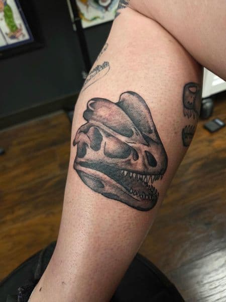 Black & Grey + Illustrative dinosaur tattoo on Calf by brent_holbrook_ on TattMe