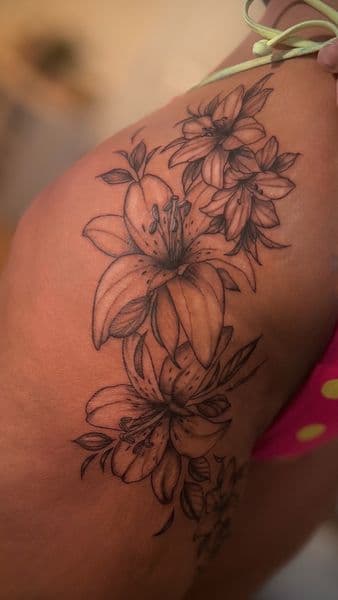 Fine Line + Floral lilies tattoo on Hip by tattedby_A on TattMe
