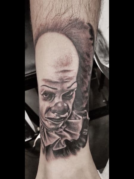 Black & Grey + Realism pennywise tattoo on Ankle by l_allen_tattoos on TattMe