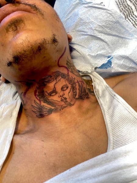 Black & Grey + Illustrative cherub tattoo on Neck (Front) by 008ink on TattMe