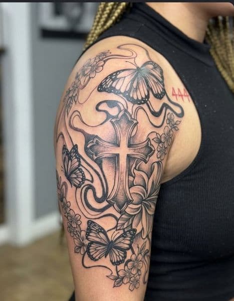 Black & Grey + Illustrative cross tattoo on Upper Arm by 8balltattoo on TattMe