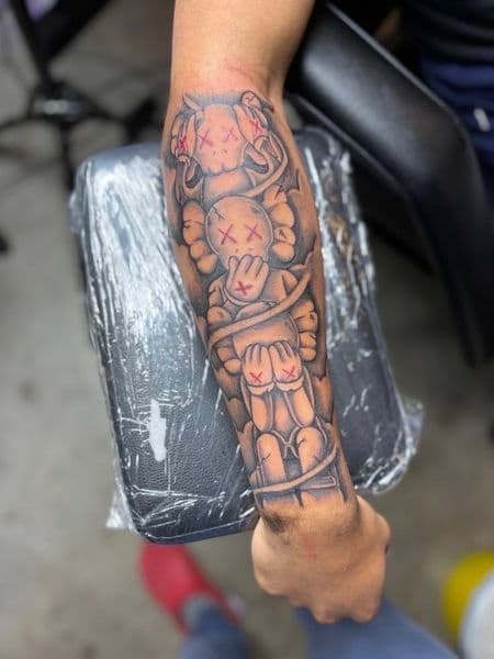 Black & Grey + Pop Culture kaws tattoo on Forearm by jayden on TattMe