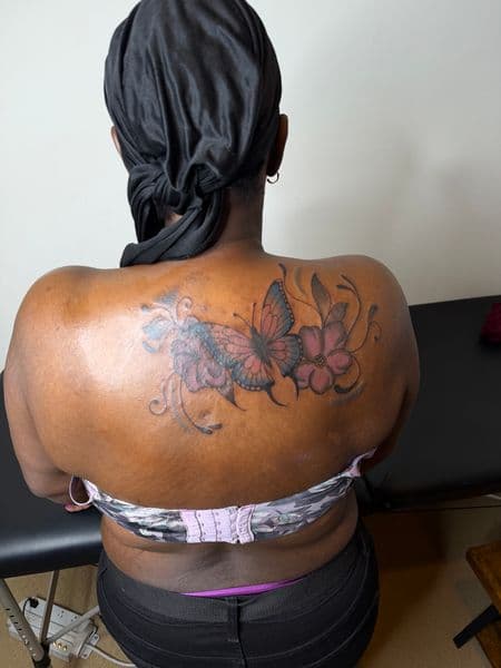 Color + Illustrative butterfly tattoo on Upper Back by itattyedyabihh on TattMe