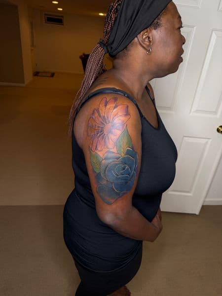 Floral + Color flower tattoo on Upper Arm by itattyedyabihh on TattMe
