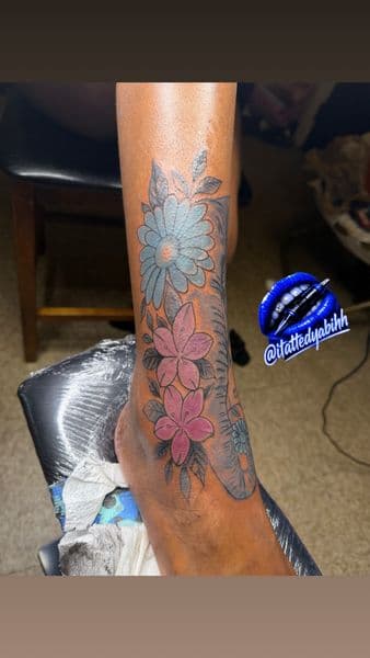Floral + Color elephant tattoo on Ankle by itattyedyabihh on TattMe