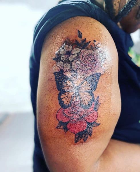 Color + Floral butterfly tattoo on Upper Arm by Dcmbrs_finest on TattMe
