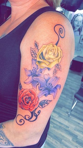 Floral + Color roses tattoo on Upper Arm by Dcmbrs_finest on TattMe