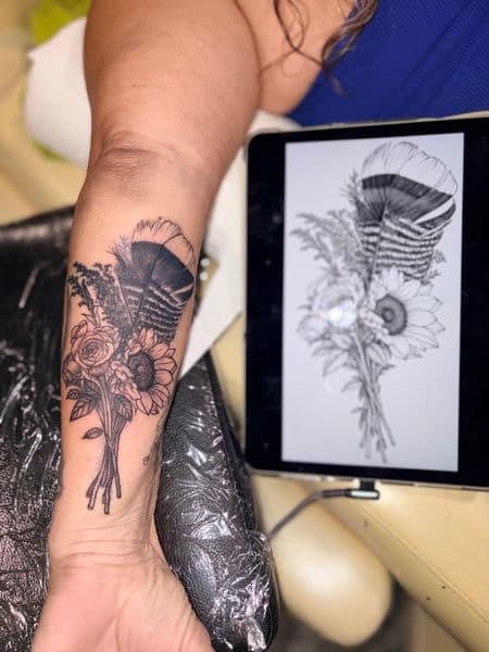 Black & Grey + Floral feather tattoo on Forearm by Dcmbrs_finest on TattMe