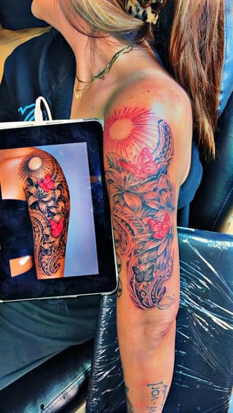 Polynesian + Floral sun tattoo on Half Sleeve by Dcmbrs_finest on TattMe