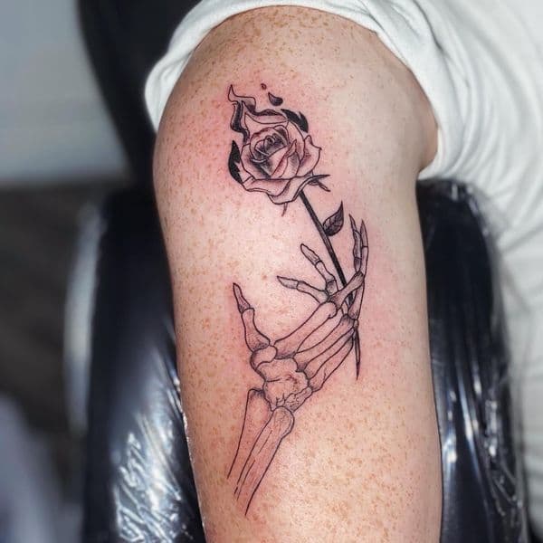 Black & Grey + Line-work skeleton hand tattoo on Upper Arm by Dcmbrs_finest on TattMe