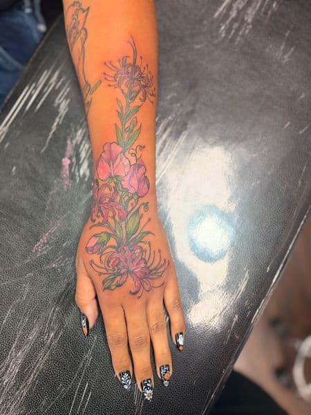 Floral + Color flowers tattoo on Forearm by TymmyTattoos on TattMe