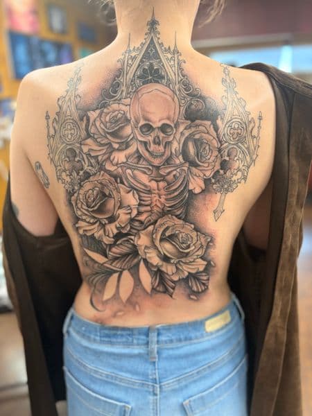 Black & Grey + Illustrative skull tattoo on Upper Back by TymmyTattoos on TattMe
