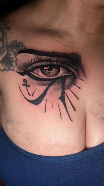 Black & Grey + Illustrative eye of horus tattoo on Chest by veelutatts on TattMe