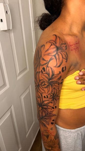 Black & Grey + Floral lilies tattoo on Half Sleeve by Slimxink on TattMe